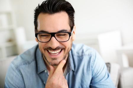 man with glasses smiling