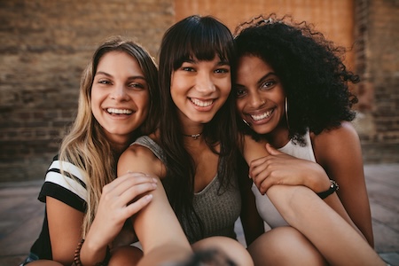 three women smiling